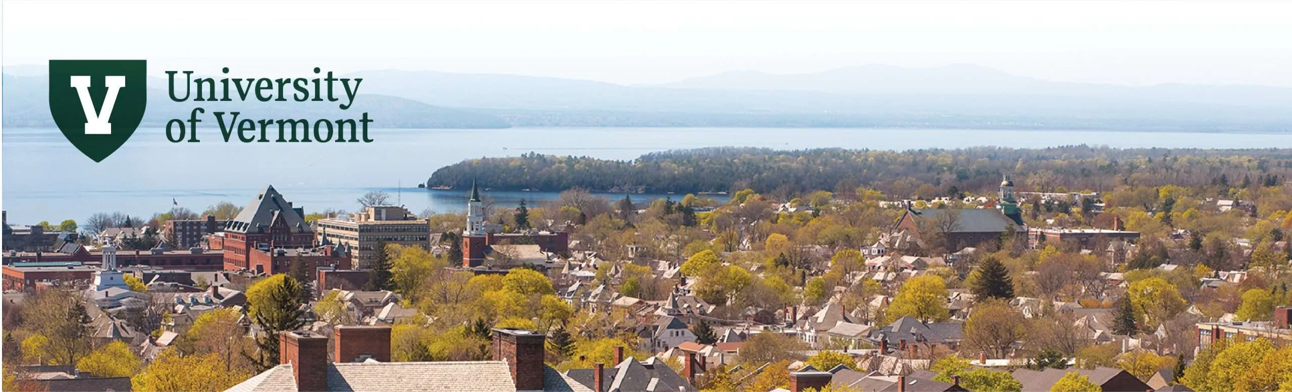 UVM logo with spring campus photo